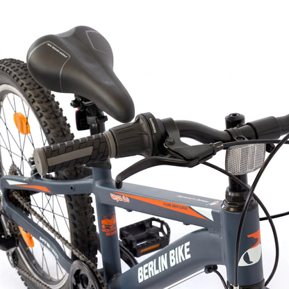 Berlin Bike Grizz Kids Mountain Bike 20 Inch front view showing handlebar and saddle orange