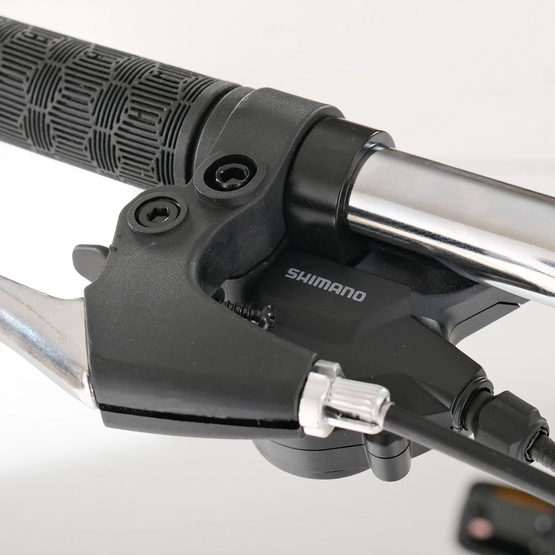 Berlin Bike Nova Grey handlebar with Shimano gear shifter and ergonomic grip detail